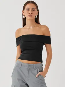 Close-up of black off-the-shoulder slim fit sexy top for women in summer fashion.