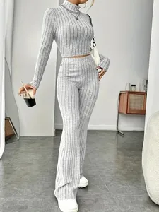 Detailed look at grey slim fit ribbed knit crop top and high waist flare pants set
