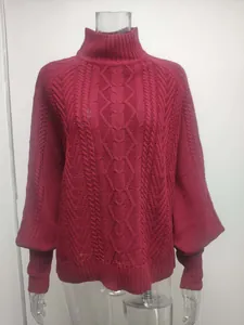 Detail of textured burgundy turtleneck sweater with elegant long lantern sleeves.