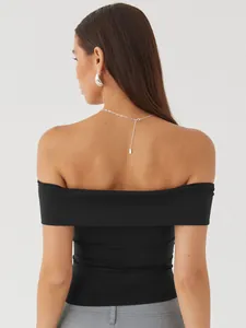 Back view of a sexy black off-the-shoulder top for women, perfect for summer chic looks.