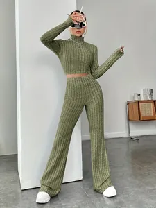 Detailed view of the green ribbed knit two-piece set featuring a crop top and flare pants