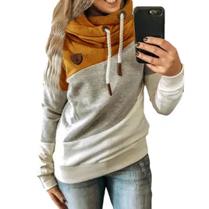 Detail view of women's color block cowl neck hoodie with ginger and grey patchwork