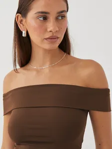 Close-up detail of a slim-fit brown off-the-shoulder top for women in summer fashion style