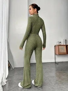 Rear view of women's green ribbed knit set with long-sleeved top and flared pants
