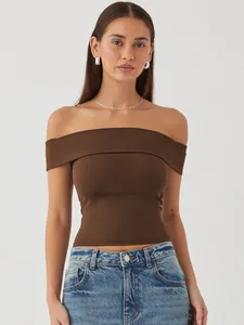 Close-up detail of women's brown off-the-shoulder slim fit top in summer style