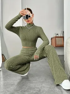 Two-piece olive green rib-knit set with high-neck crop top and wide-leg trousers