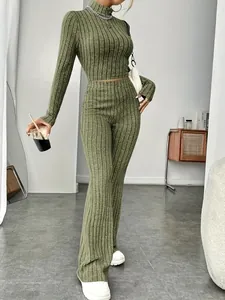 Close-up of olive green ribbed knit set with a slim-fit crop top and flare pants