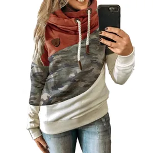 Detail of women's cowl neck color-block sweatshirt with camouflage and rust red panels