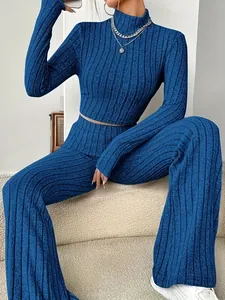 Royal blue ribbed knit two-piece set featuring long sleeve crop top and wide leg trousers