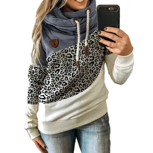 Detail view of women's cowl neck sweatshirt with leopard print color-blocking