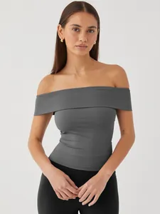 Detail shot showing a grey off-the-shoulder slim fit top with an elegant fold-over neckline
