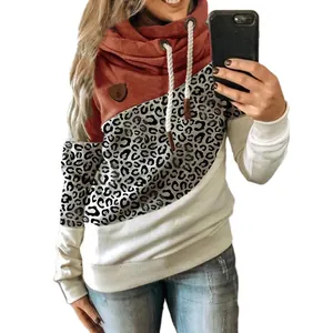 Detail showing women's color-block hoodie with leopard print and a stylish cowl neck.