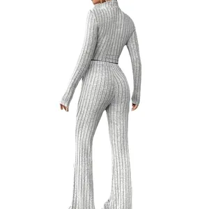 Grey ribbed knit two-piece set featuring a cropped long sleeve top and flared pants