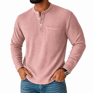 Detailed view showing the waffle knit texture and chest pocket of a pink Henley shirt