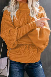 Detailed view of women's orange cable-knit sweater with elegant lantern sleeves