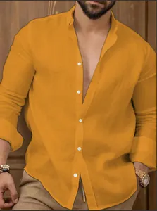 Close-up detail of a mustard yellow cotton linen men's shirt with white buttons