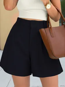 Detailed view of fashionable high-waisted black A-line shorts for a chic summer look