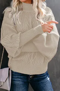 Elegant beige cable knit sweater featuring lantern sleeves and a cozy mock neck detail