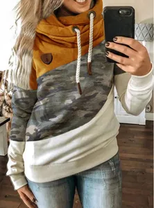 Detailed view of women's color-blocked cowl neck hoodie featuring camouflage and mustard yellow