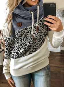 Detailed view of cowl neck hoodie featuring leopard print patchwork and adjustable drawstrings.