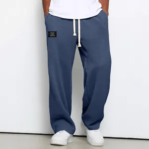 Trendy men's loose blue waffle-knit sports sweatpants with a straight-leg design