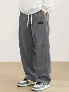 Premium grey loose fit corduroy trousers for men featuring drawstring waist and label detail