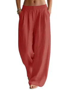Close-up of vibrant red linen wide-leg pants featuring a comfortable elastic waistband.