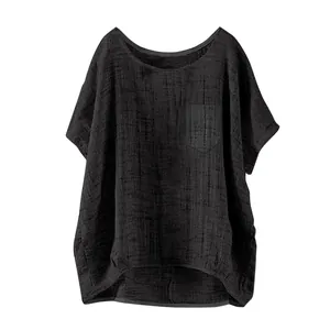 Detail view of black loose linen top for women showing breathable textured fabric