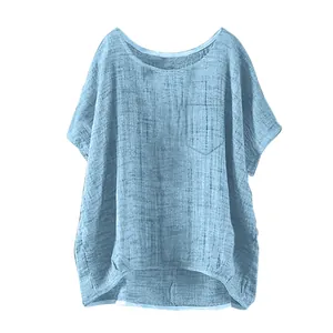 Close-up of a casual light blue loose-fitting linen top for women with a chest pocket
