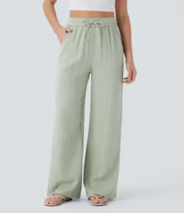High-waisted sage green linen wide-leg pants with drawstring and side pockets.