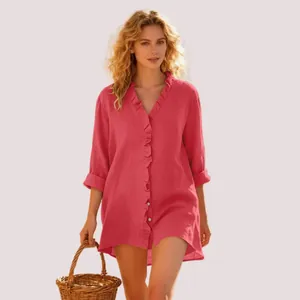 Elegant women's coral pink ruffled V-neck long sleeve shirt for a casual summer look