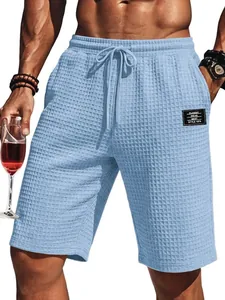 Detailed view of the premium waffle texture on light blue casual men's summer shorts