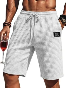 Detail view of white waffle knit texture on men's casual summer beach shorts
