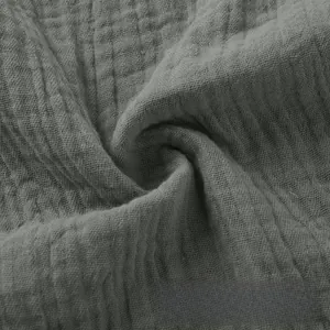 Macro view showing the breathable grey cotton linen fabric texture for casual shorts