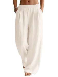 Women's flowy white linen wide-leg pants with elastic waist and pockets for summer vacation