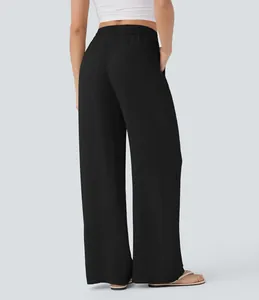 Back view of black high-waisted wide-leg linen pants featuring an elastic waistband.
