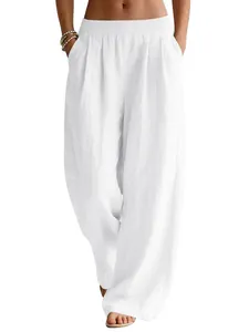 Women's white linen wide-leg pants with elastic waist and pockets for summer beach travel