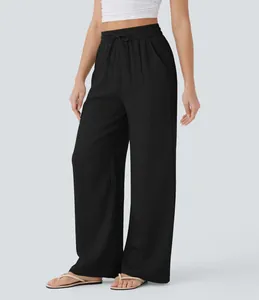 Black high-waisted wide-leg linen pants with drawstring and functional side pockets