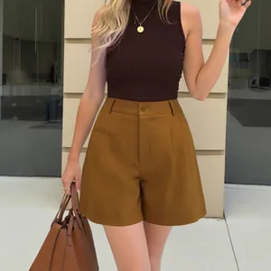 Elegant high-waisted wide-leg A-line shorts for women in mustard brown fashion style.