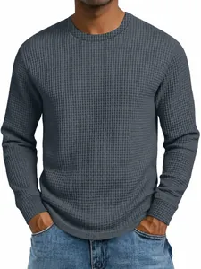 Detailed view of men's slim fit waffle knit long sleeve shirt in dark grey.