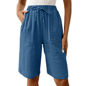 Detailed view of women's blue cotton linen shorts featuring drawstring waist and pockets