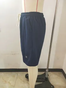 Side view of comfortable navy blue waffle knit men's casual shorts on a mannequin