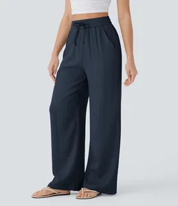 High-waisted navy blue wide-leg linen pants with adjustable drawstring waist and side pockets.