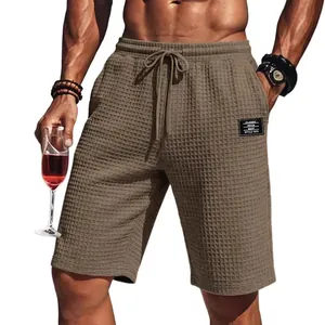 Khakifarbene Waffelstrick-Shorts für Herren mit Kordelzug und strukturierter Optik