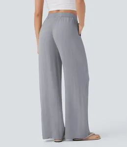 Back view detail of high-waisted gray linen wide-leg pants showing relaxed fit and drape