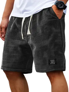 Macro view of men's waffle knit casual shorts highlighting the breathable fabric texture.