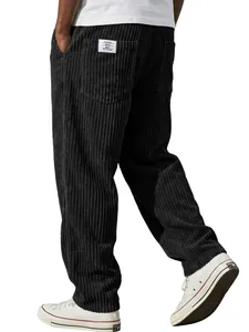 Detail of men's loose straight corduroy pants with white patch and classic vertical stripes.