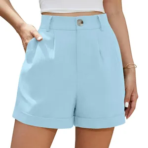 Close-up of light blue high-waisted cotton linen shorts with button and pockets detail