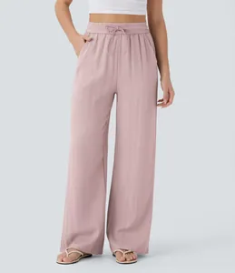 Detailed view of dusty pink wide-leg linen pants with drawstring and side pockets.
