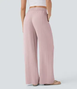 Detailed back view of flowy pink high-waisted wide-leg linen pants with comfortable elastic waist